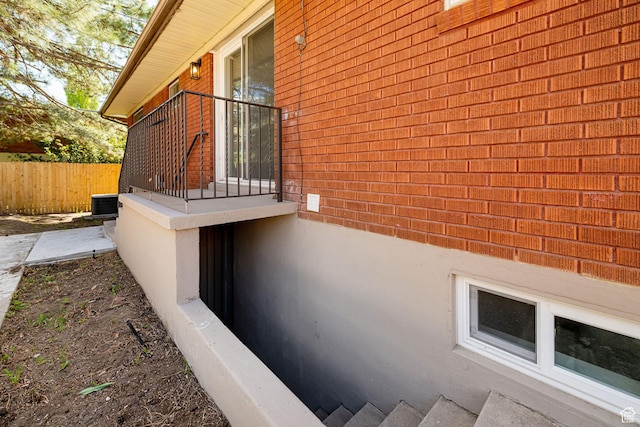 4432 Orchard Ave, South Ogden, UT 84403 - view of side of home with fence, central air condition unit, and brick siding