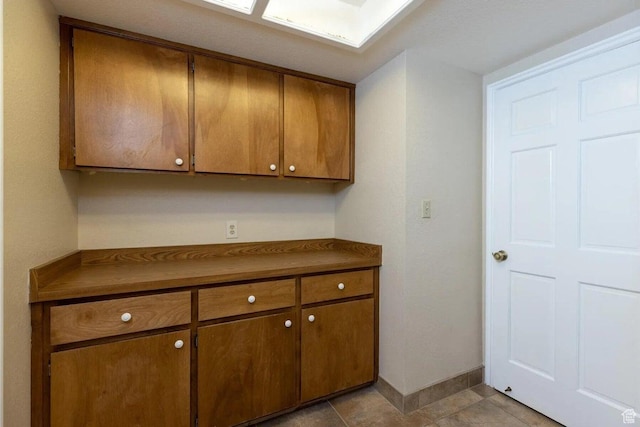 623 E 160 S, St George, UT 84770 - kitchen with dark countertops, baseboards, and brown cabinetry