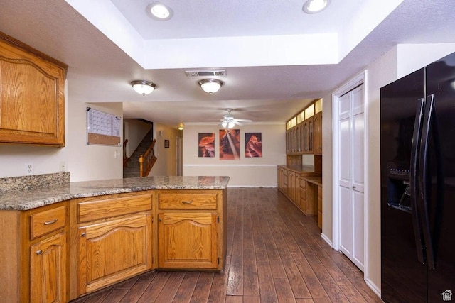 623 E 160 S, St George, UT 84770 - kitchen featuring visible vents, a peninsula, dark wood-style floors, brown cabinets, and black fridge