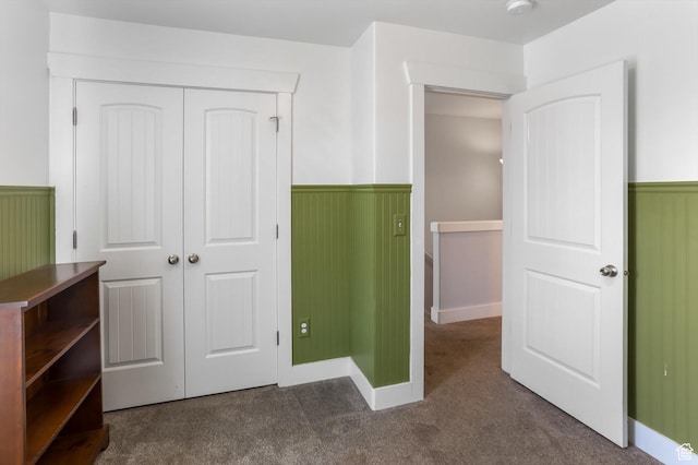 1150 W 200 S, Logan, UT 84321 - unfurnished bedroom featuring a closet, carpet, and a wainscoted wall