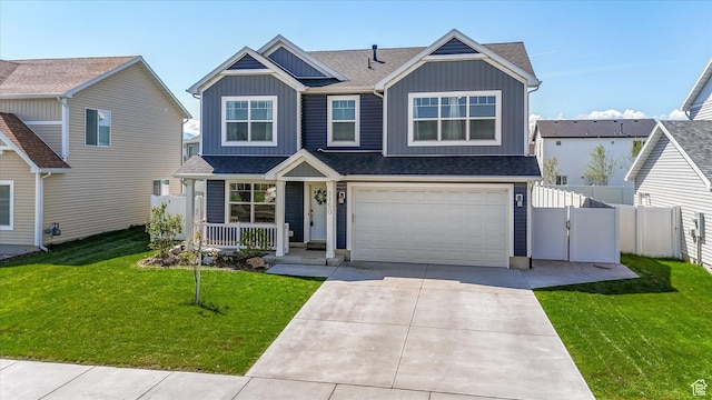 1150 W 200 S, Logan, UT 84321 - view of front of property featuring fence, roof with shingles, board and batten siding, covered porch, and driveway