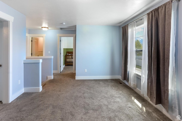 1150 W 200 S, Logan, UT 84321 - spare room featuring baseboards and carpet