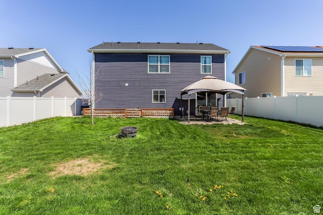 1150 W 200 S, Logan, UT 84321 - back of property featuring a lawn, a gazebo, a patio area, and an outdoor fire pit