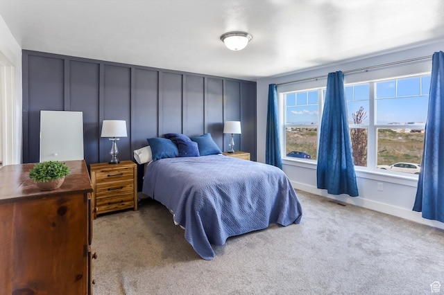 1150 W 200 S, Logan, UT 84321 - carpeted bedroom featuring visible vents and a decorative wall