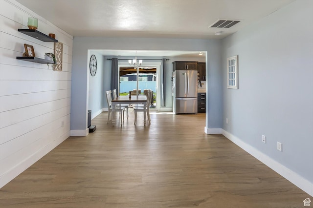 1150 W 200 S, Logan, UT 84321 - dining room featuring wood finished floors, baseboards, a chandelier, and visible vents