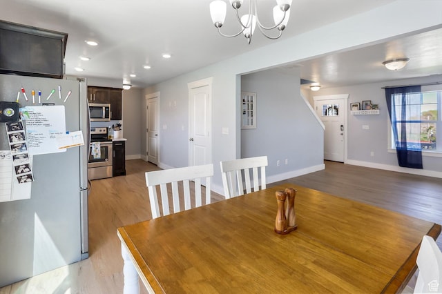 1150 W 200 S, Logan, UT 84321 - dining room with baseboards, recessed lighting, light wood-style flooring, and a chandelier