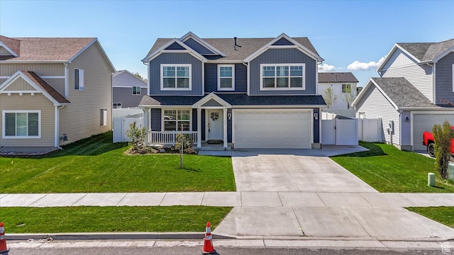 1150 W 200 S, Logan, UT 84321 - craftsman-style house featuring a front lawn, board and batten siding, fence, and driveway