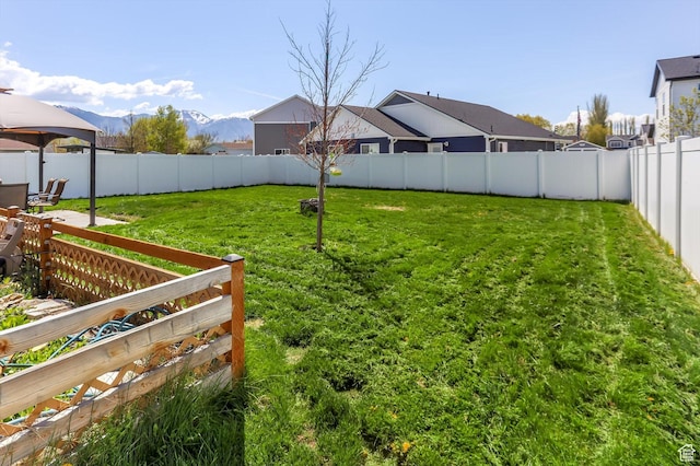 1150 W 200 S, Logan, UT 84321 - view of yard featuring a gazebo, a fenced backyard, and a mountain view
