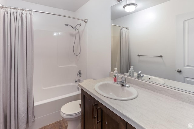 1150 W 200 S, Logan, UT 84321 - full bathroom featuring vanity, toilet, wood finished floors, and shower / tub combo with curtain