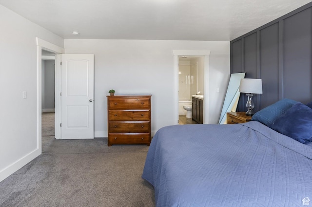 1150 W 200 S, Logan, UT 84321 - carpeted bedroom with baseboards and ensuite bathroom