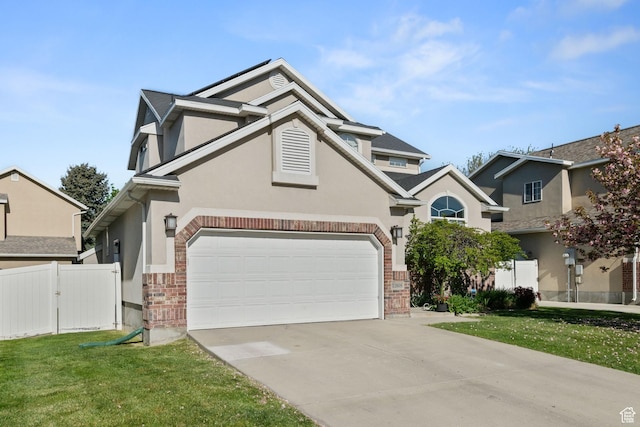 traditional-style home with fence, a front lawn, brick siding, stucco siding, and concrete driveway