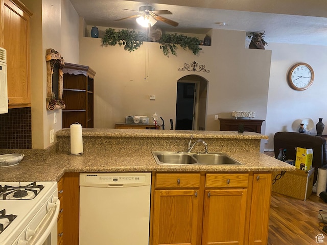 948 Shetland Ln Unit 17, Farmington, UT 84025 - kitchen with white dishwasher, ceiling fan, a sink, wood finished floors, and arched walkways