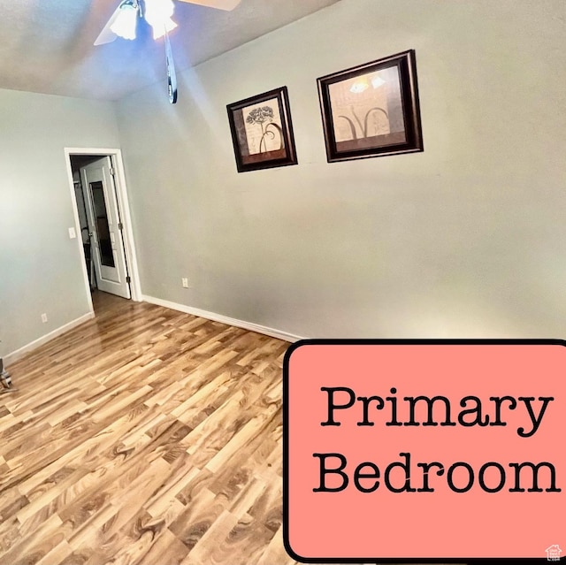 948 Shetland Ln Unit 17, Farmington, UT 84025 - unfurnished bedroom with wood finished floors, baseboards, and ceiling fan