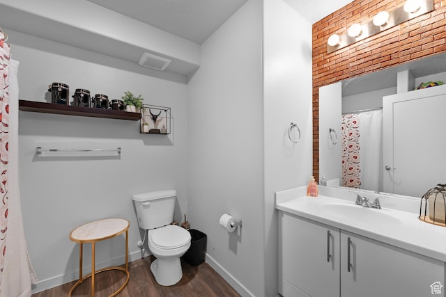 1700 S Sandhill Rd S Unit F301, Orem, UT 84058 - bathroom featuring vanity, toilet, baseboards, wood finished floors, and visible vents