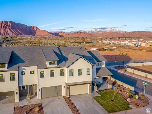 2600 Ocotillo Way Unit 31, Santa Clara, UT 84765 - view of front of home with stucco siding, an attached garage, driveway, and a mountain view