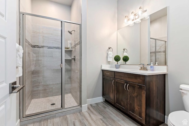 2600 Ocotillo Way Unit 31, Santa Clara, UT 84765 - full bath featuring toilet, wood finished floors, a stall shower, and vanity