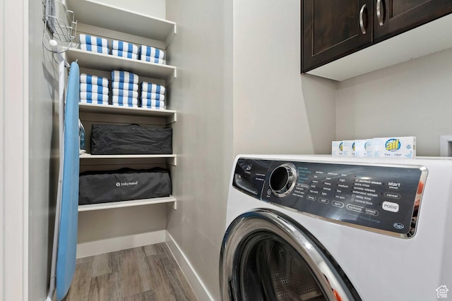 2600 Ocotillo Way Unit 31, Santa Clara, UT 84765 - clothes washing area with cabinet space, wood finished floors, and baseboards