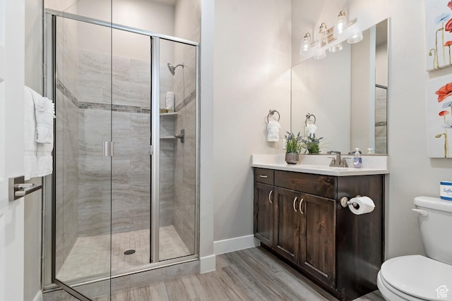 2600 Ocotillo Way Unit 31, Santa Clara, UT 84765 - bathroom featuring toilet, a stall shower, wood finished floors, and vanity