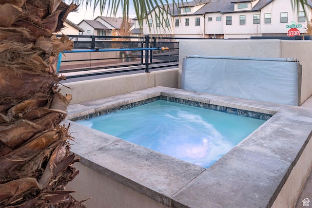 2600 Ocotillo Way Unit 31, Santa Clara, UT 84765 - view of pool featuring an in-ground hot tub and a residential view