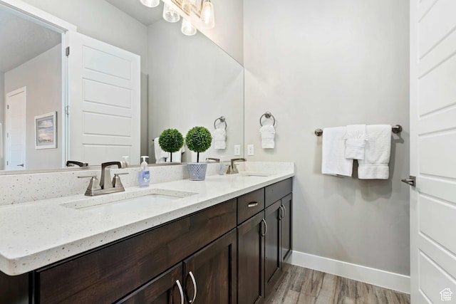 2600 Ocotillo Way Unit 31, Santa Clara, UT 84765 - bathroom with wood finished floors, double vanity, and baseboards