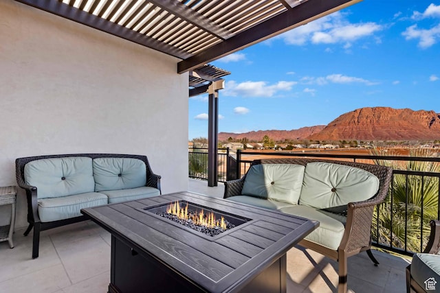 2600 Ocotillo Way Unit 31, Santa Clara, UT 84765 - balcony featuring a mountain view, a pergola, an outdoor living space with a fire pit, and a patio area