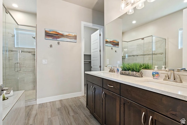 2600 Ocotillo Way Unit 31, Santa Clara, UT 84765 - bathroom featuring a shower stall, double vanity, wood finished floors, baseboards, and recessed lighting
