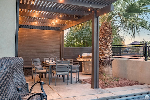 2600 Ocotillo Way Unit 31, Santa Clara, UT 84765 - patio terrace at dusk with a pergola, outdoor dining space, fence, and grilling area