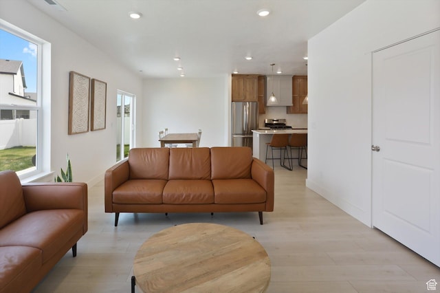 3030 S 400 W, Nibley, UT 84321 - living room with baseboards, recessed lighting, and light wood-style flooring