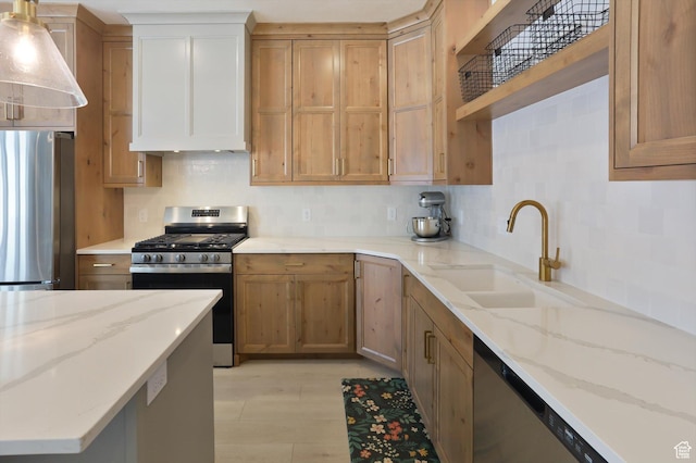 3030 S 400 W, Nibley, UT 84321 - kitchen featuring wall chimney range hood, light stone countertops, appliances with stainless steel finishes, a sink, and backsplash