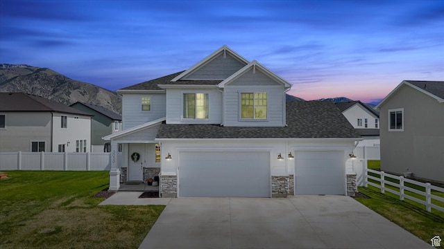 3030 S 400 W, Nibley, UT 84321 - view of front of home featuring fence, a shingled roof, concrete driveway, and a front yard