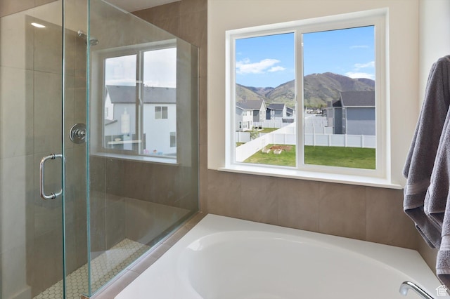 3030 S 400 W, Nibley, UT 84321 - full bathroom with a garden tub, a mountain view, and a shower stall