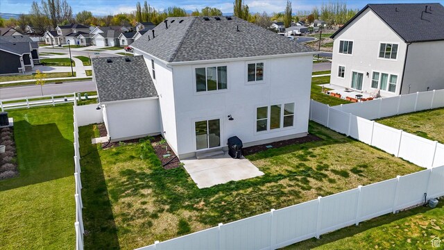 3030 S 400 W, Nibley, UT 84321 - rear view of house featuring a shingled roof, a fenced backyard, a yard, and a residential view