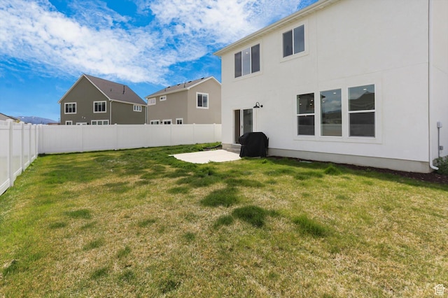 3030 S 400 W, Nibley, UT 84321 - back of house with a lawn, a patio, a fenced backyard, and stucco siding
