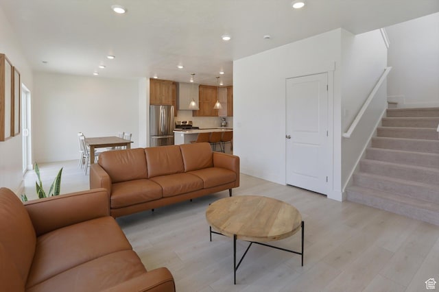 3030 S 400 W, Nibley, UT 84321 - living room featuring recessed lighting, light wood-style flooring, and stairs
