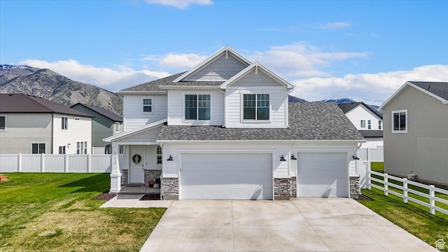 3030 S 400 W, Nibley, UT 84321 - view of front of property with stone siding, fence, driveway, and a front yard