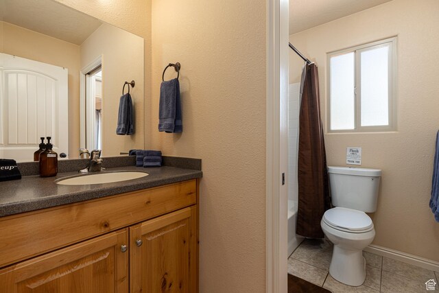 300 E 300 N Unit L5, Kanab, UT 84741 - bathroom featuring tile patterned floors, toilet, vanity, and shower / bathtub combination with curtain