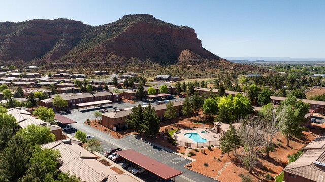 300 E 300 N Unit L5, Kanab, UT 84741 - aerial view of residential area with a pool area and mountains