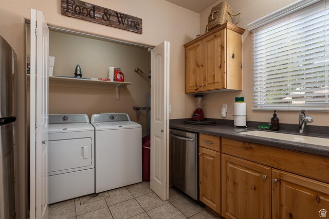 300 E 300 N Unit L5, Kanab, UT 84741 - laundry room featuring washing machine and dryer and light tile patterned floors