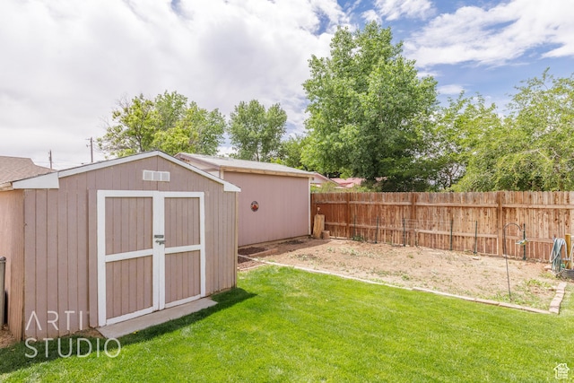 view of shed featuring a fenced backyard