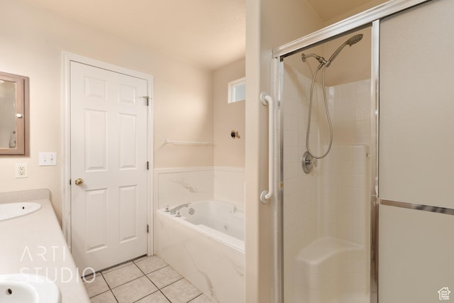 bathroom with tile patterned flooring, a shower stall, a bath, and vanity