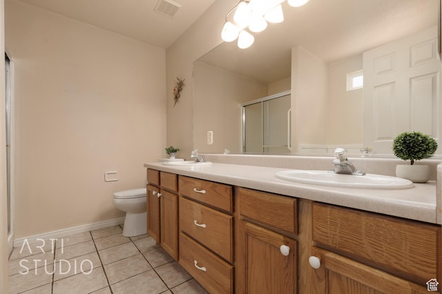 bathroom with a sink, tile patterned flooring, double vanity, visible vents, and a stall shower