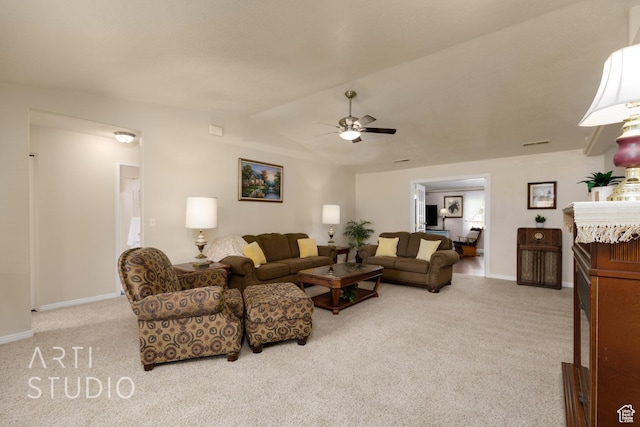 living area featuring vaulted ceiling, baseboards, carpet, and a ceiling fan