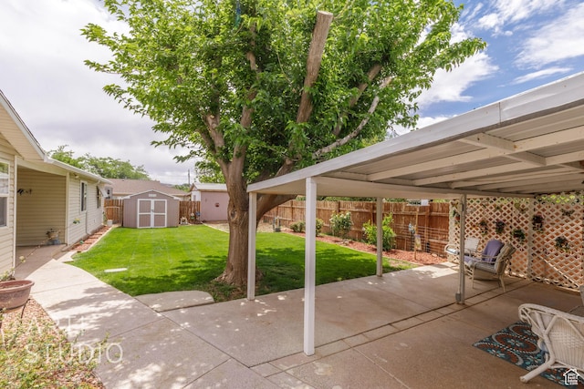view of patio with a fenced backyard, a storage unit, and an outbuilding