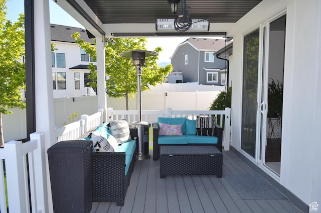 deck featuring fence and an outdoor hangout area