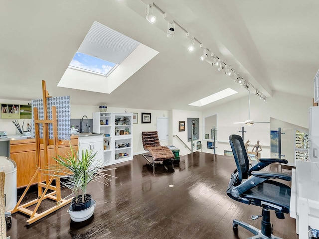 799 Northpoint Ct, Salt Lake City, UT 84103 - office space with a skylight, rail lighting, wood finished floors, and vaulted ceiling