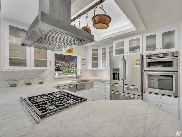 799 Northpoint Ct, Salt Lake City, UT 84103 - kitchen featuring appliances with stainless steel finishes, exhaust hood, light stone countertops, and white cabinetry