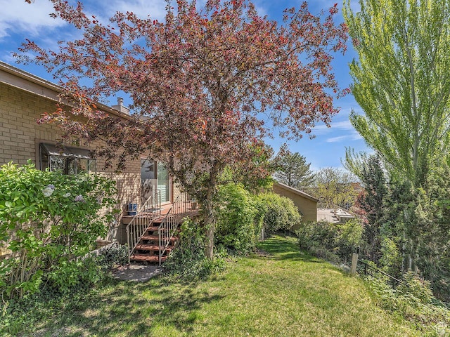 799 Northpoint Ct, Salt Lake City, UT 84103 - view of grassy yard featuring a wooden deck and stairs