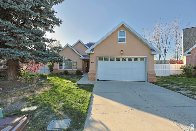 849 E Forest Farm Cir S, Salt Lake City, UT 84106 - single story home with a front lawn, fence, stucco siding, brick siding, and concrete driveway
