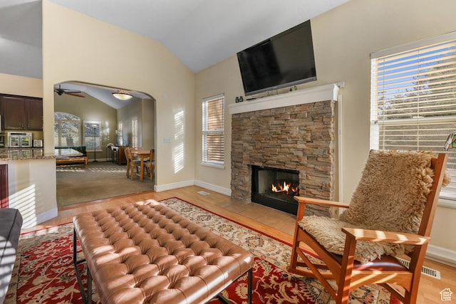 849 E Forest Farm Cir S, Salt Lake City, UT 84106 - living room with light wood finished floors, ceiling fan, vaulted ceiling, and a fireplace