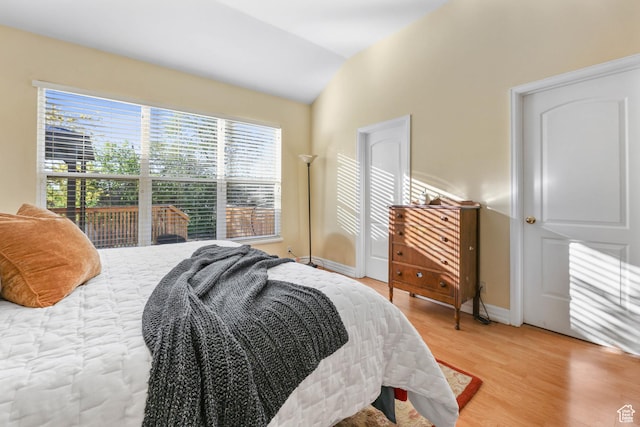 849 E Forest Farm Cir S, Salt Lake City, UT 84106 - bedroom with baseboards, light wood finished floors, and lofted ceiling